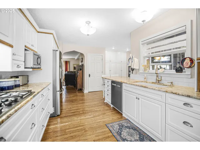 a large kitchen with cabinets