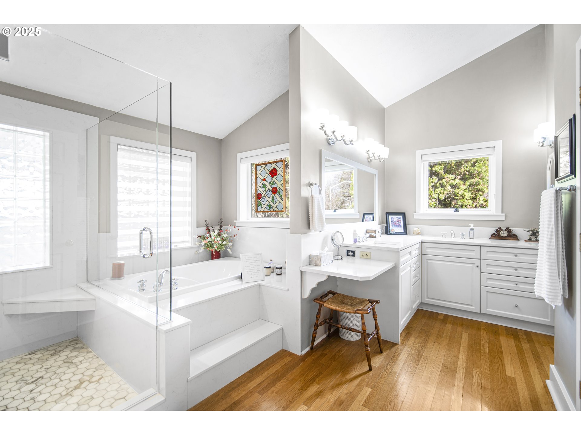 898 Northwest Riverside Boulevard Bend, OR 97703 - Photo 20 of 32 a large white room with a large window a table and chairs