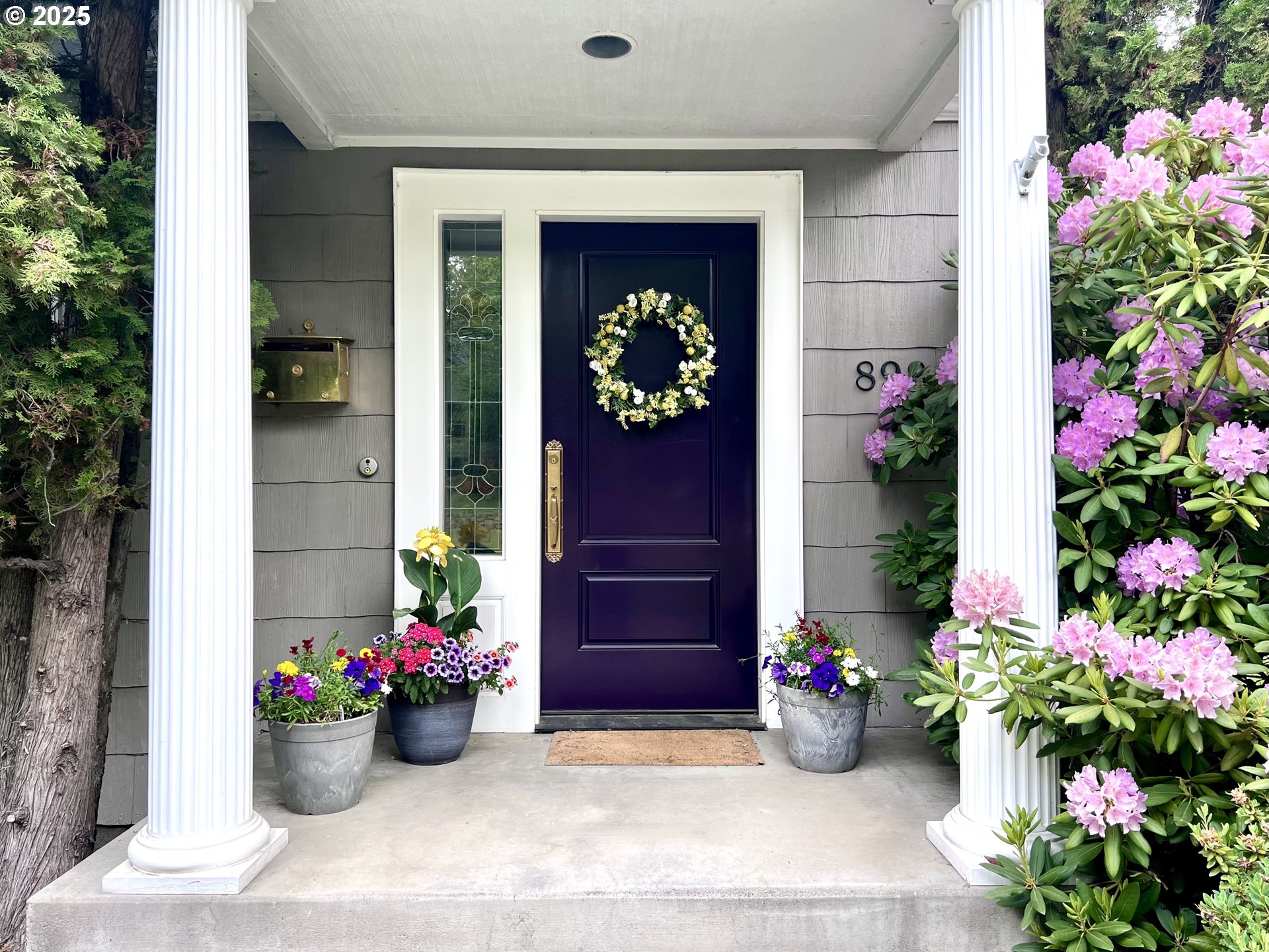 898 Northwest Riverside Boulevard Bend, OR 97703 - Photo 2 of 32 a view of a entryway with flower pots
