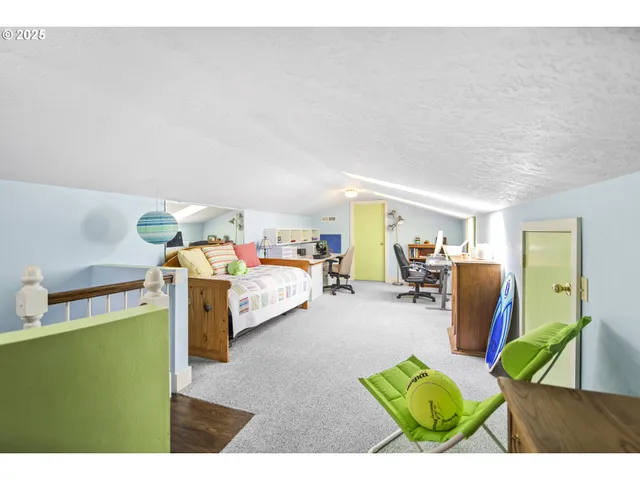 a bed room with furniture and a table