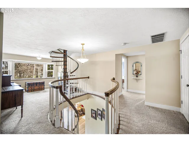 a view of a livingroom with furniture and workspace