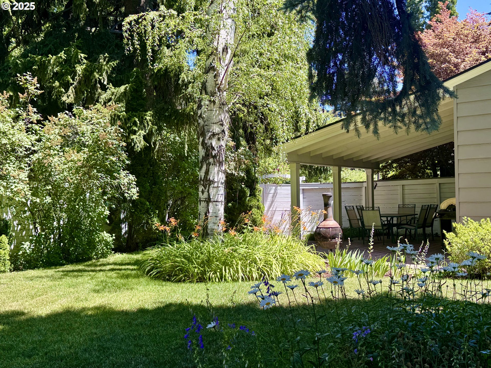 898 Northwest Riverside Boulevard Bend, OR 97703 - Photo 30 of 32 a view of a backyard with garden
