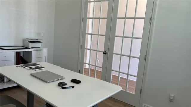 a bathroom with a toilet and a window