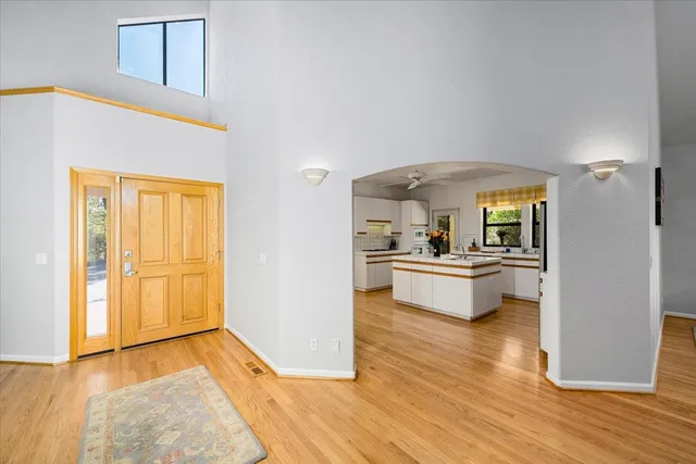 a kitchen that has a sink stainless steel appliances a counter space and a window