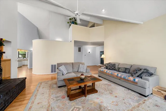 a bedroom with a large bed and a large window