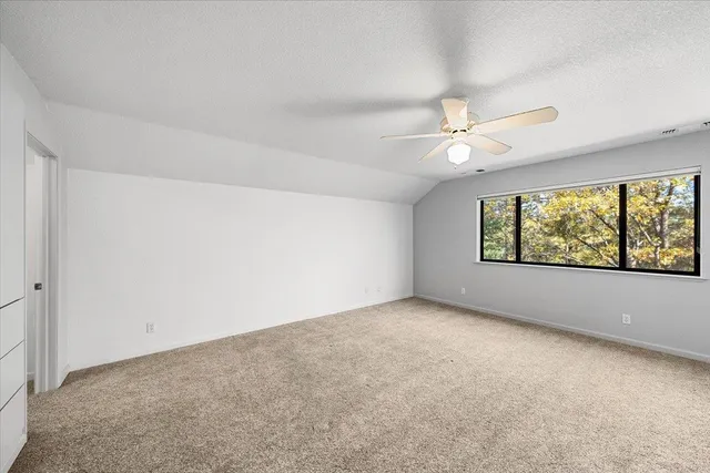 a view of a backyard with swimming pool