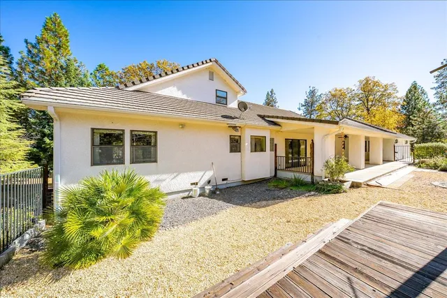 a picture of a room with a white wall and a painting