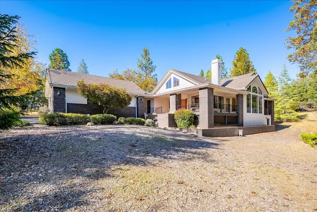 a view of a house with a yard and garage