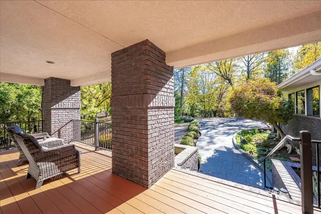 a view of a porch with wooden floor and outdoor space