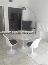 801 8th Street, Unit 104 Miami Beach, FL 33139 - Photo 2 of 5 a bathroom with a sink and a mirror