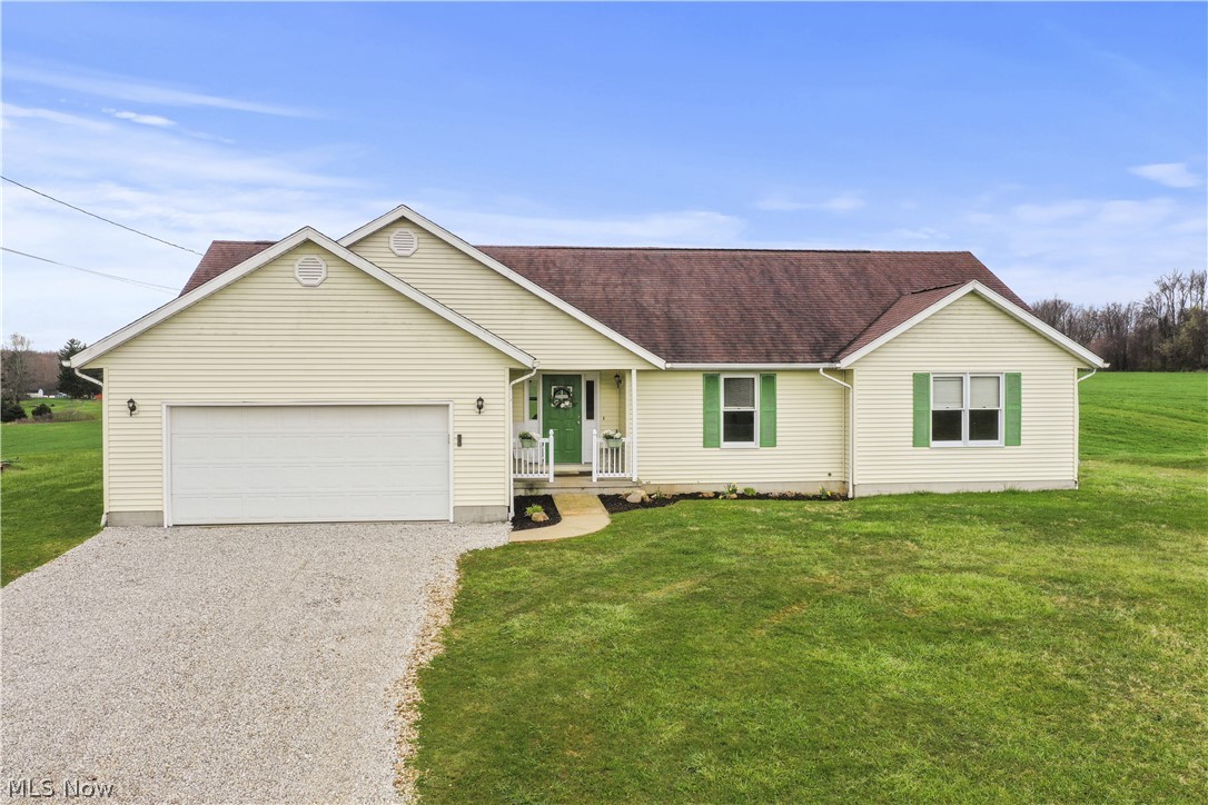 1106 Apple Ridge Road Clinton, OH 44216 - Photo 1 of 27 Single story home with a front yard and a garage