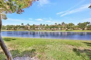 a view of a lake with houses in the back