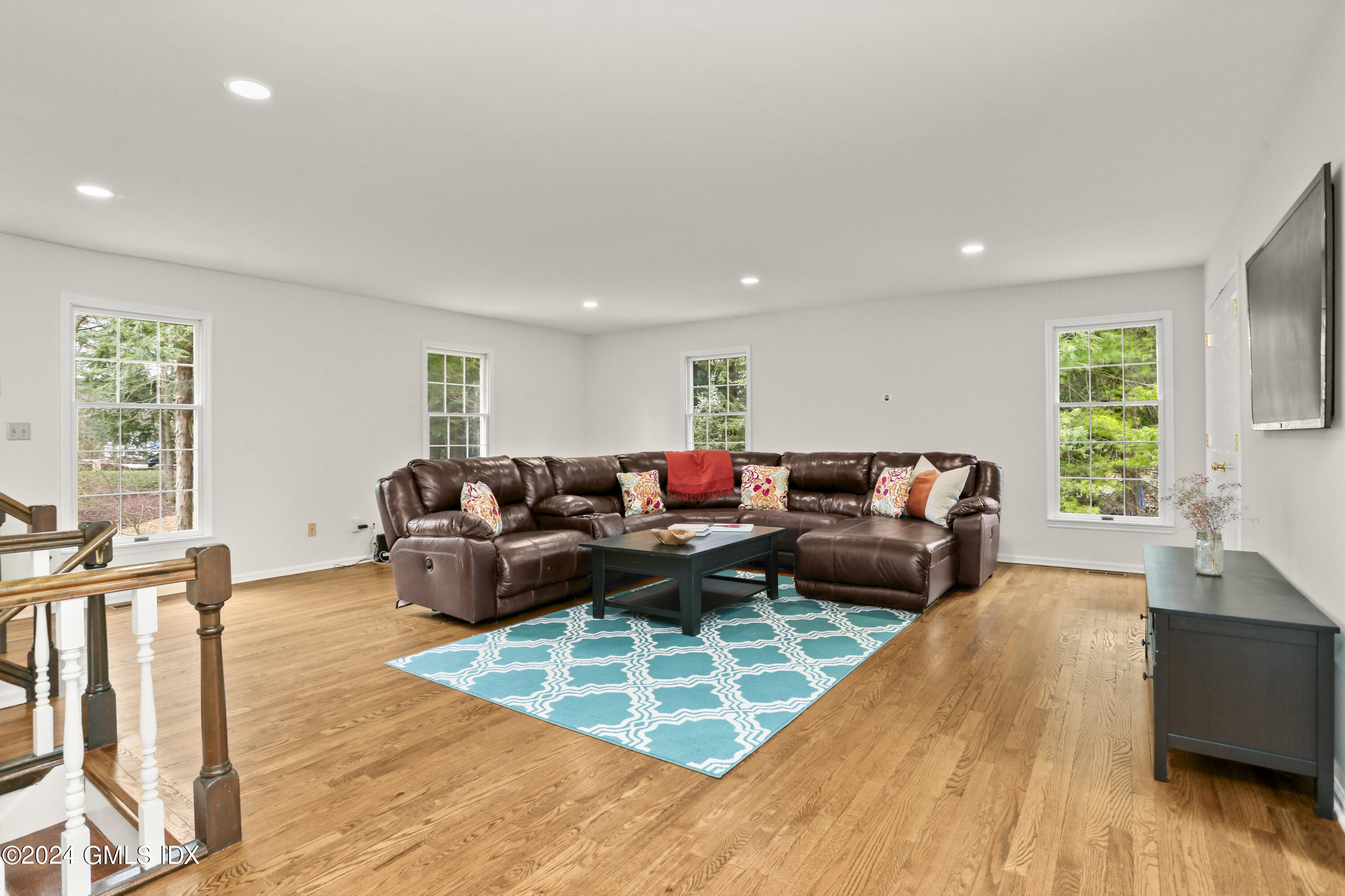 677 Westover Road Stamford, CT 06902 - Photo 31 of 42 a living room with furniture and a wooden floor