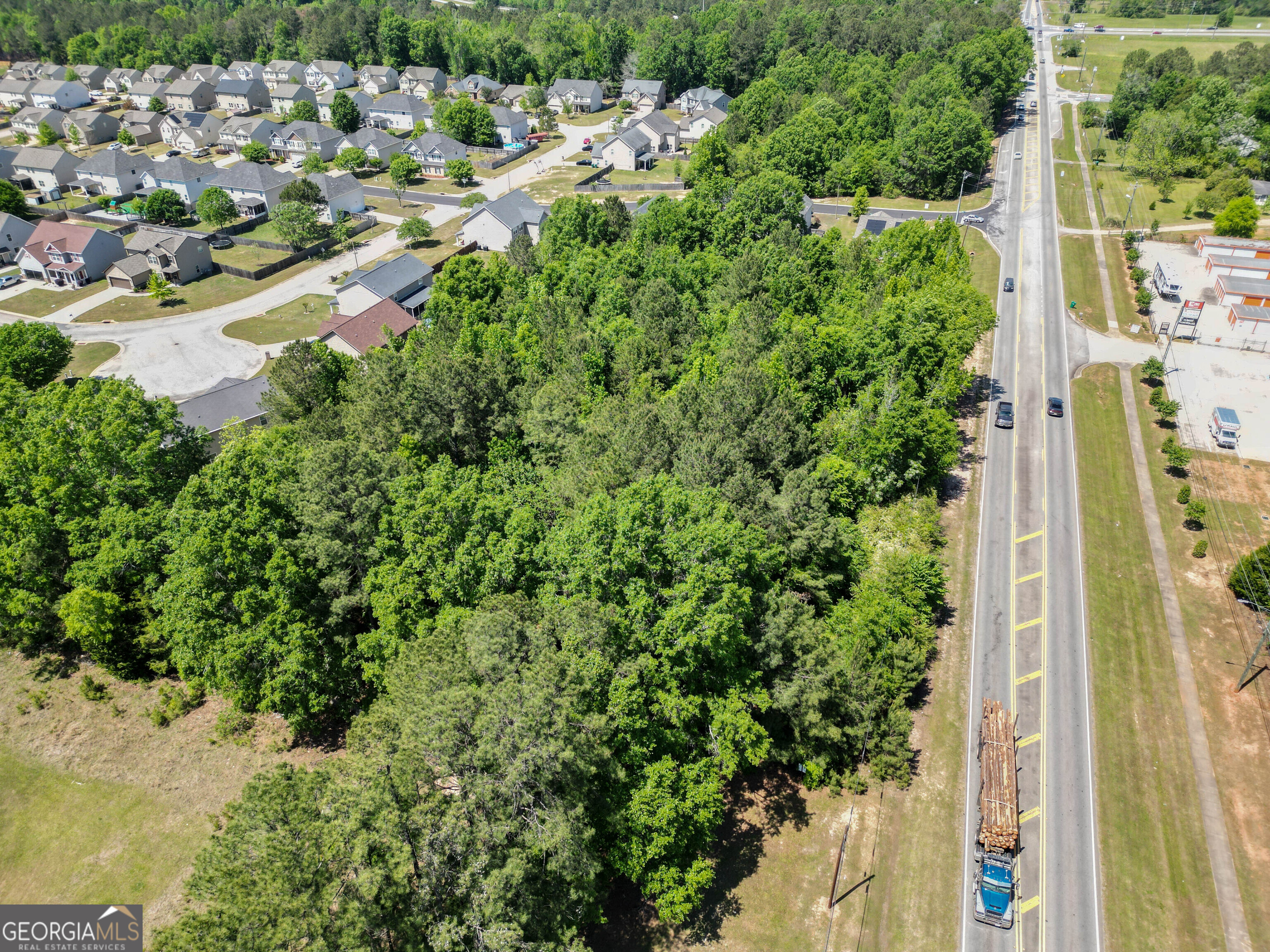 0 Macon Road Perry, GA 31069 - Photo 1 of 19 a view of a yard with plants and large trees