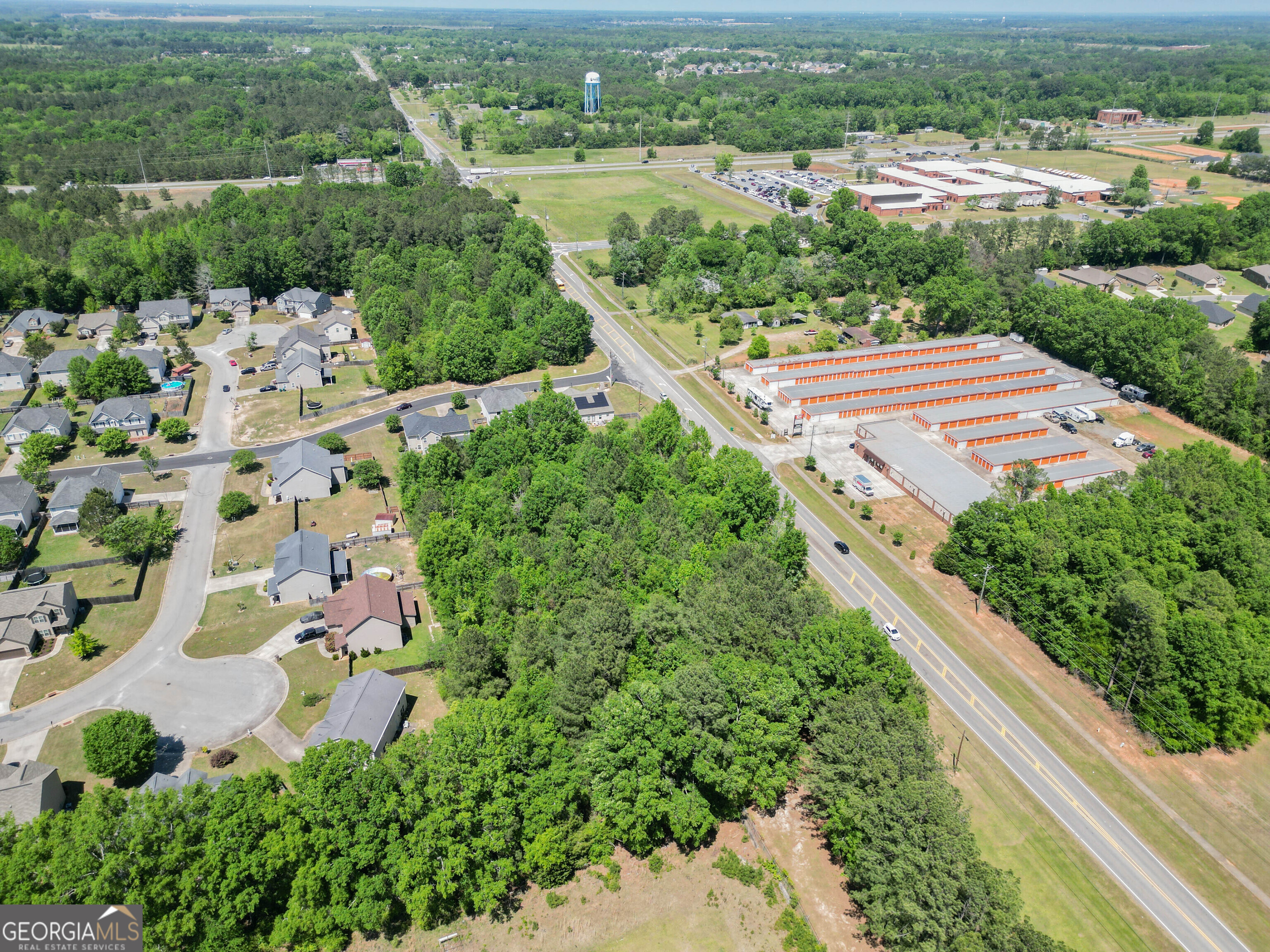 0 Macon Road Perry, GA 31069 - Photo 16 of 19 an aerial view of a house with a yard and lake view in back