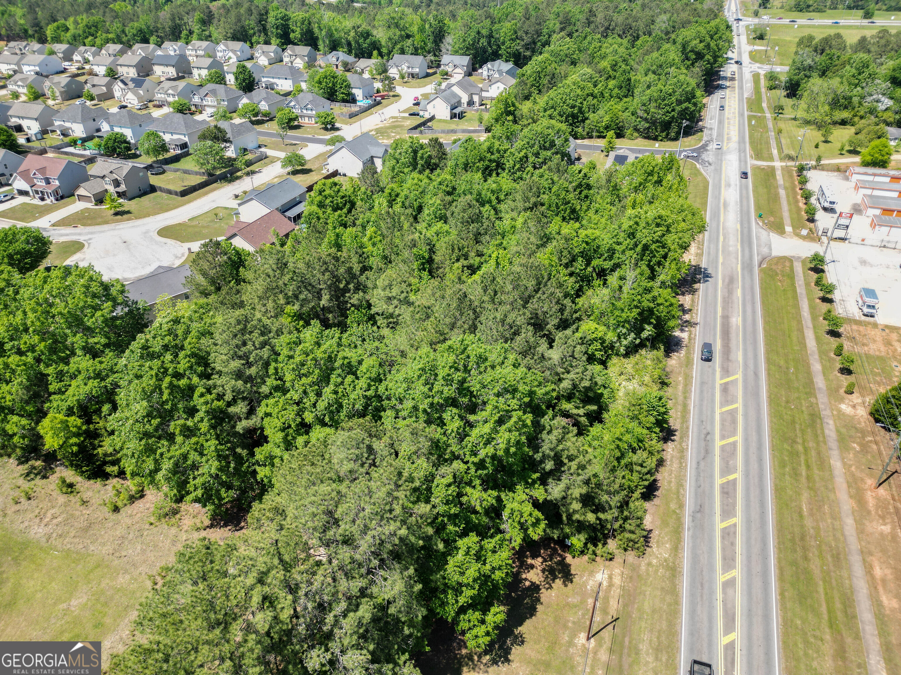 0 Macon Road Perry, GA 31069 - Photo 3 of 19 an aerial view of residential houses with outdoor space and trees