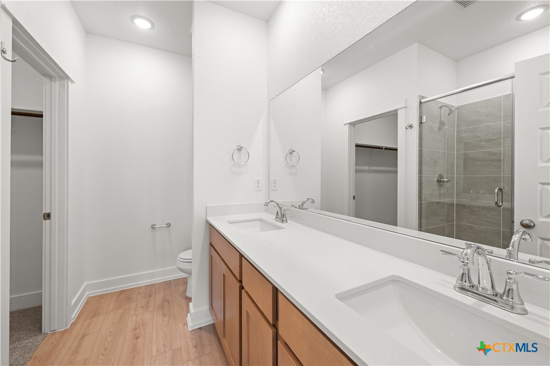 1218 Cilantro Road Temple, TX 76501 - Photo 11 of 16 a bathroom with a sink and a mirror