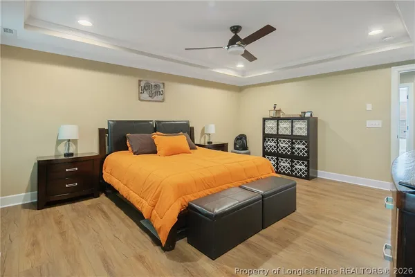 a bedroom with a bed and closet with table