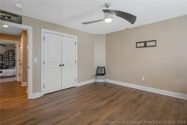 a bedroom with a bed furniture and a chandelier
