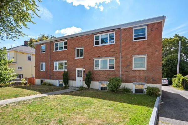 a front view of a house with yard