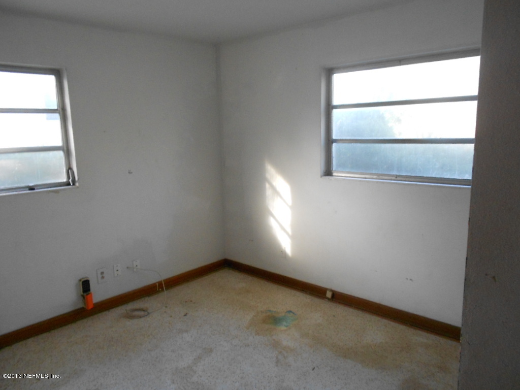 3765 Bess Road Jacksonville, FL 32277 - Photo 8 of 8 an empty room with a window