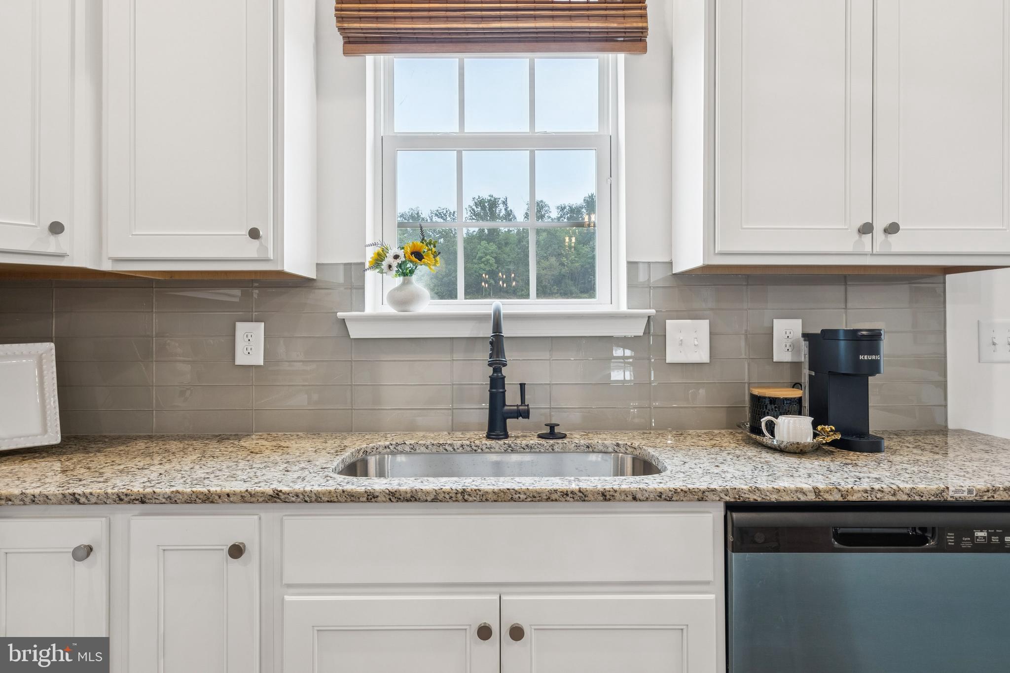 136 Piedmont Way, Unit 102 Hanover, PA 17331 - Photo 15 of 40 a kitchen with granite countertop stainless steel appliances granite countertop white cabinets and a window