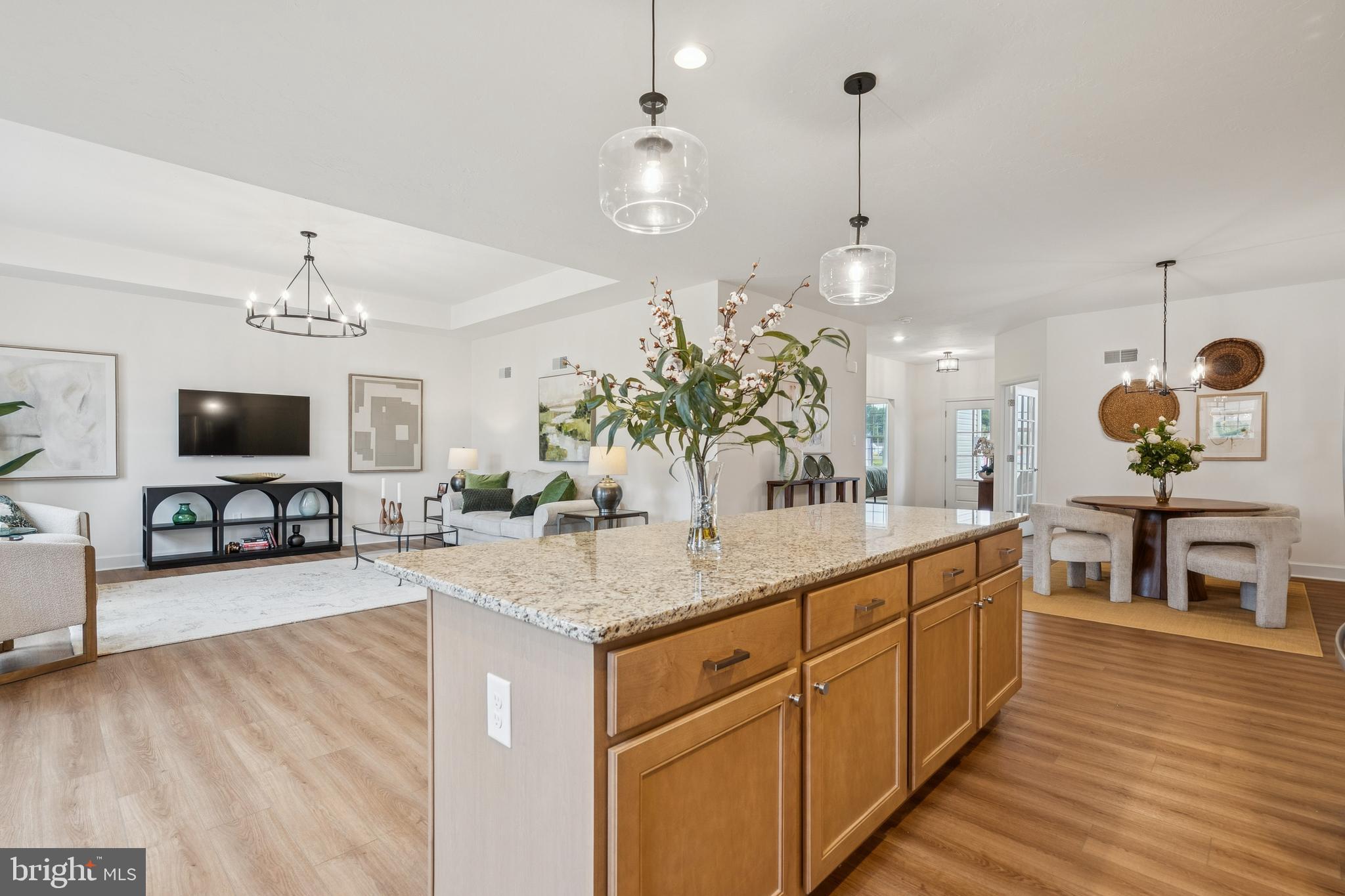 136 Piedmont Way, Unit 102 Hanover, PA 17331 - Photo 16 of 40 a view of living room kitchen island with furniture and wooden floor