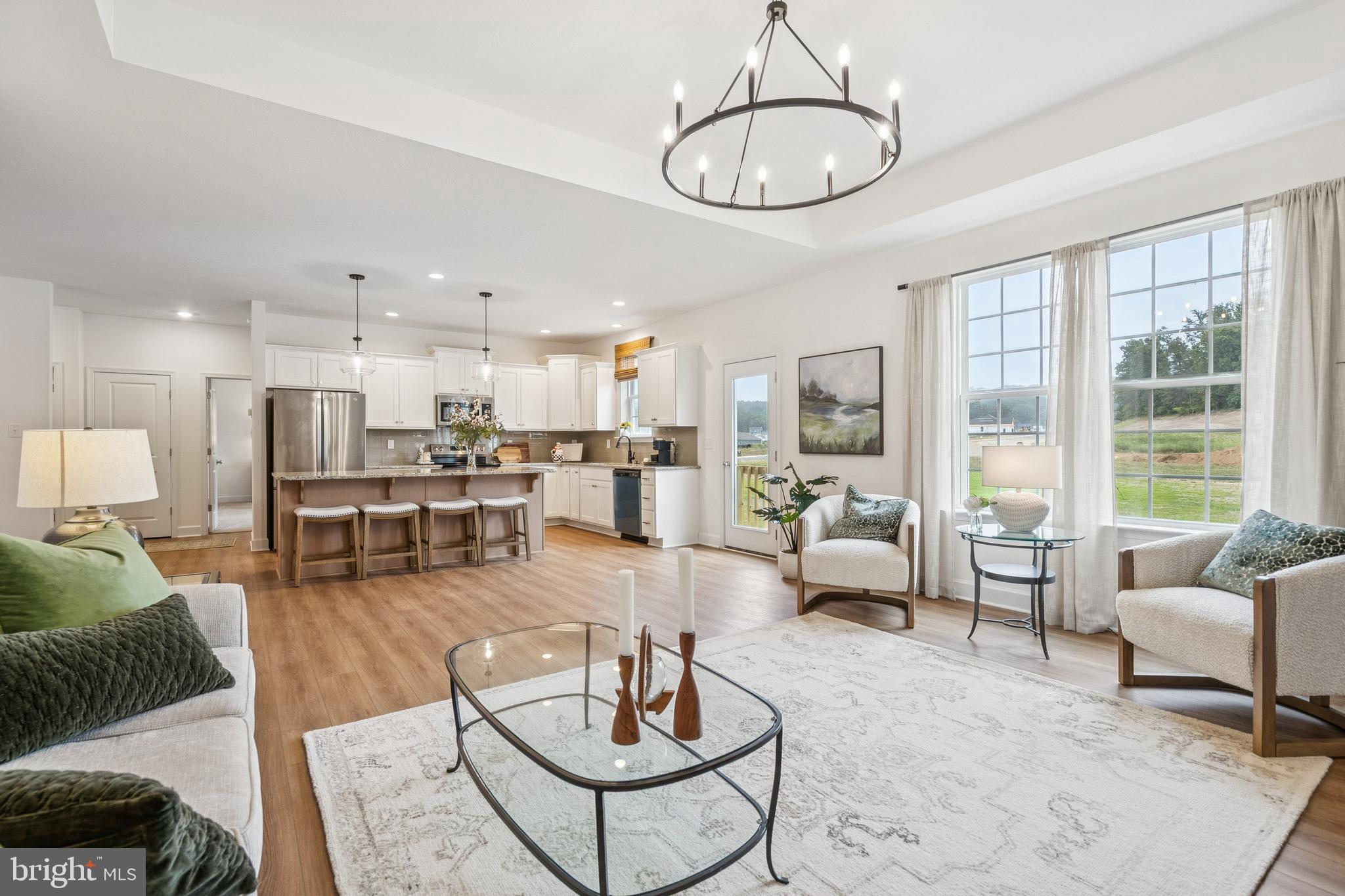 136 Piedmont Way, Unit 102 Hanover, PA 17331 - Photo 22 of 40 a living room with furniture and a view of kitchen