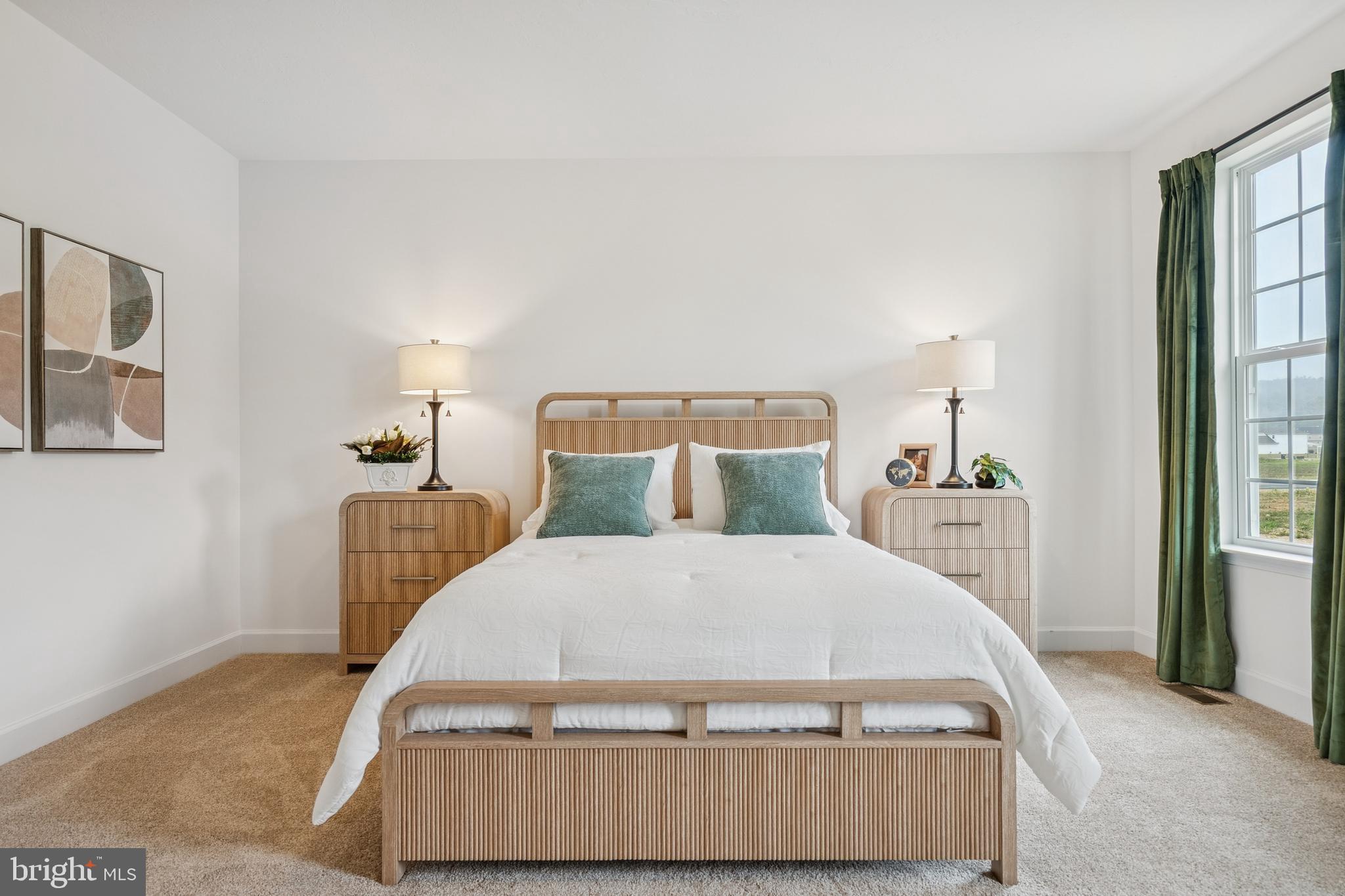 136 Piedmont Way, Unit 102 Hanover, PA 17331 - Photo 27 of 40 a bed sitting in a bedroom next to a lamp with window