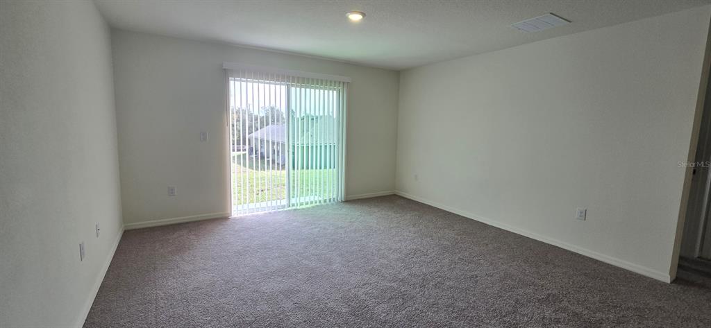 17159 Southwest 42nd Terrace Ocala, FL 34473 - Photo 11 of 17 a view of an empty room with a window
