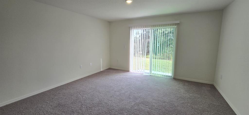 17159 Southwest 42nd Terrace Ocala, FL 34473 - Photo 12 of 17 a view of an empty room with a window