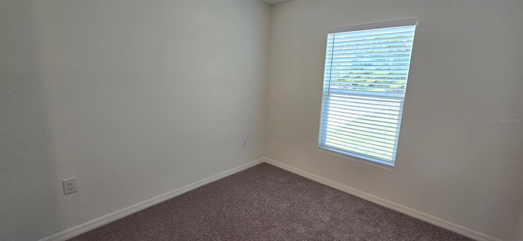 17159 Southwest 42nd Terrace Ocala, FL 34473 - Photo 13 of 17 an empty room with a window