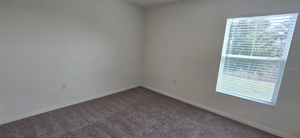 17159 Southwest 42nd Terrace Ocala, FL 34473 - Photo 15 of 17 a view of an empty room with a window