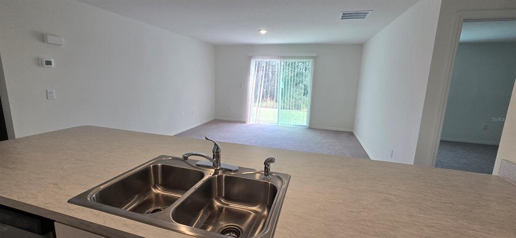 17159 Southwest 42nd Terrace Ocala, FL 34473 - Photo 6 of 17 a kitchen that has a sink and a stove