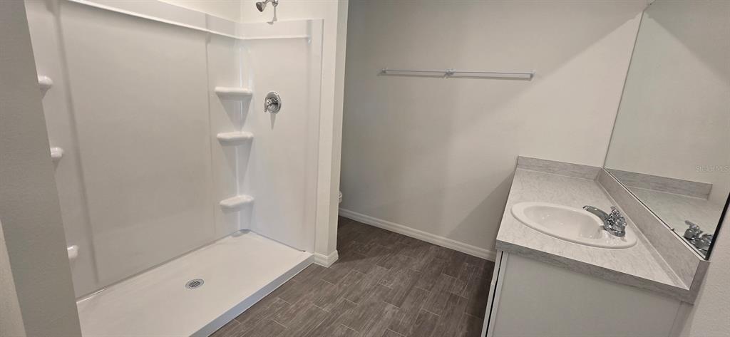 17159 Southwest 42nd Terrace Ocala, FL 34473 - Photo 9 of 17 a bathroom with a sink a toilet and shower