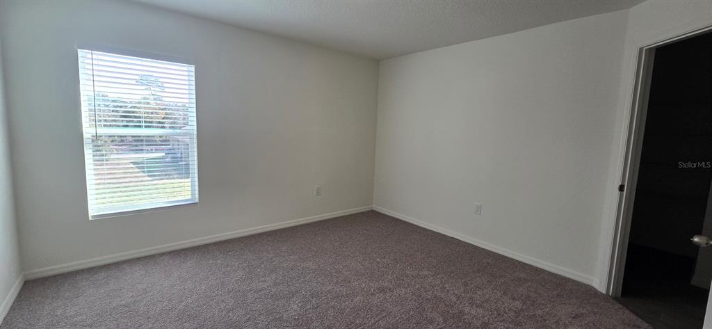 17159 Southwest 42nd Terrace Ocala, FL 34473 - Photo 10 of 17 an empty room with a window