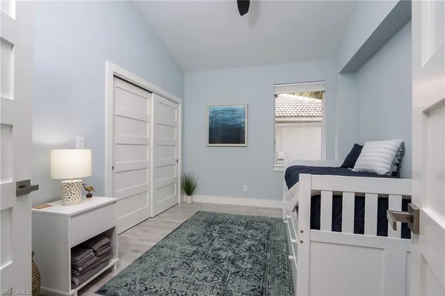 a bedroom with furniture and a window