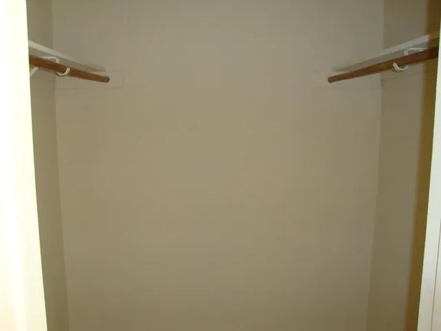 a bathroom with a granite countertop sink and a bathtub