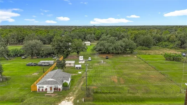 a view of a swimming pool with a yard