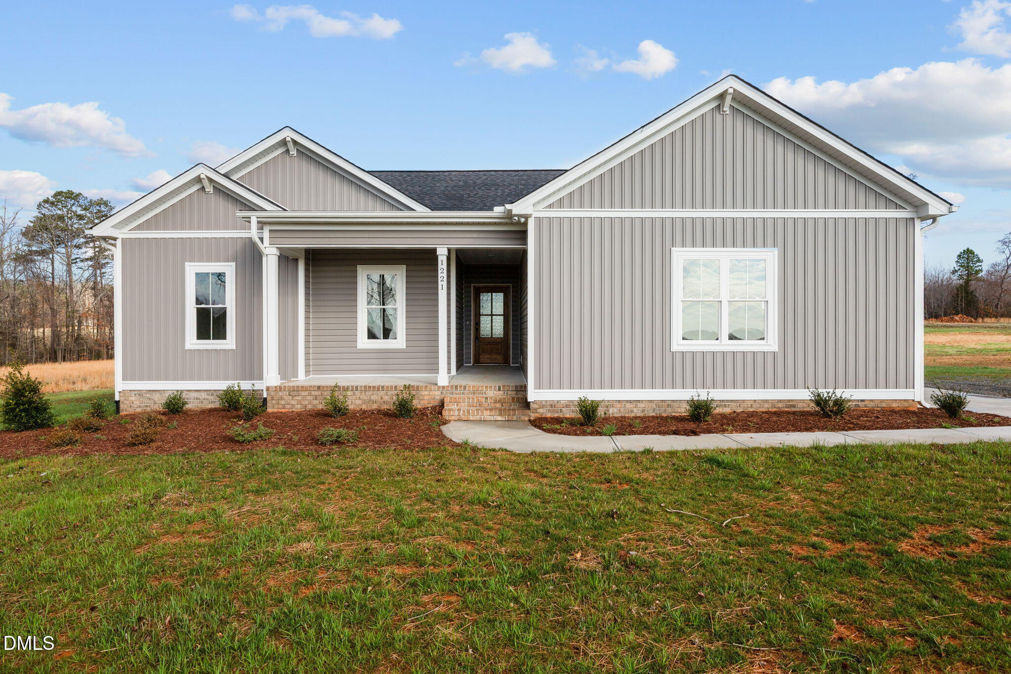 1221 Antioch Church Road Timberlake, NC 27583 - Photo 1 of 45 a front view of a house with a yard