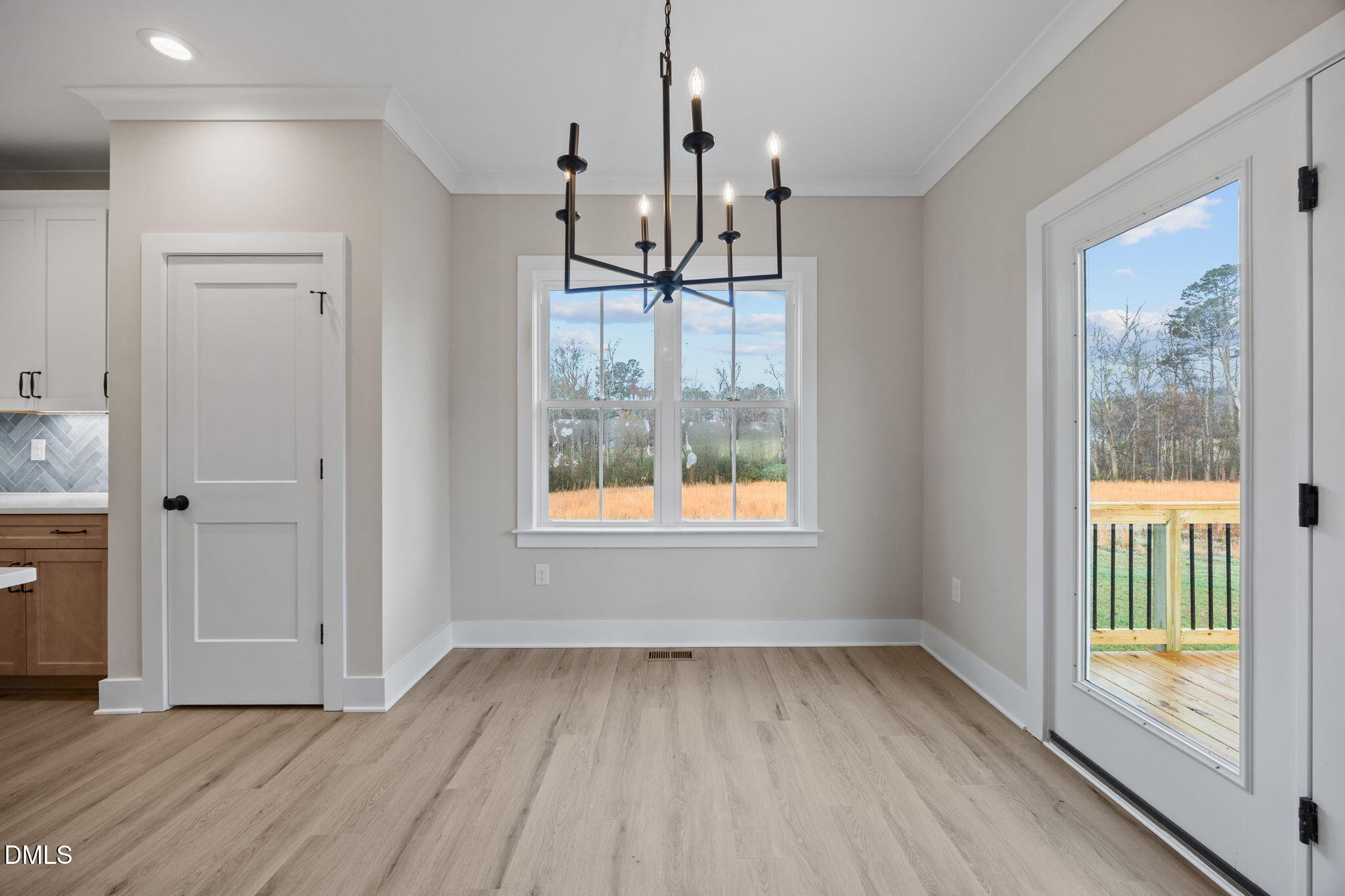 1221 Antioch Church Road Timberlake, NC 27583 - Photo 14 of 45 a view of empty room with wooden floor and fan