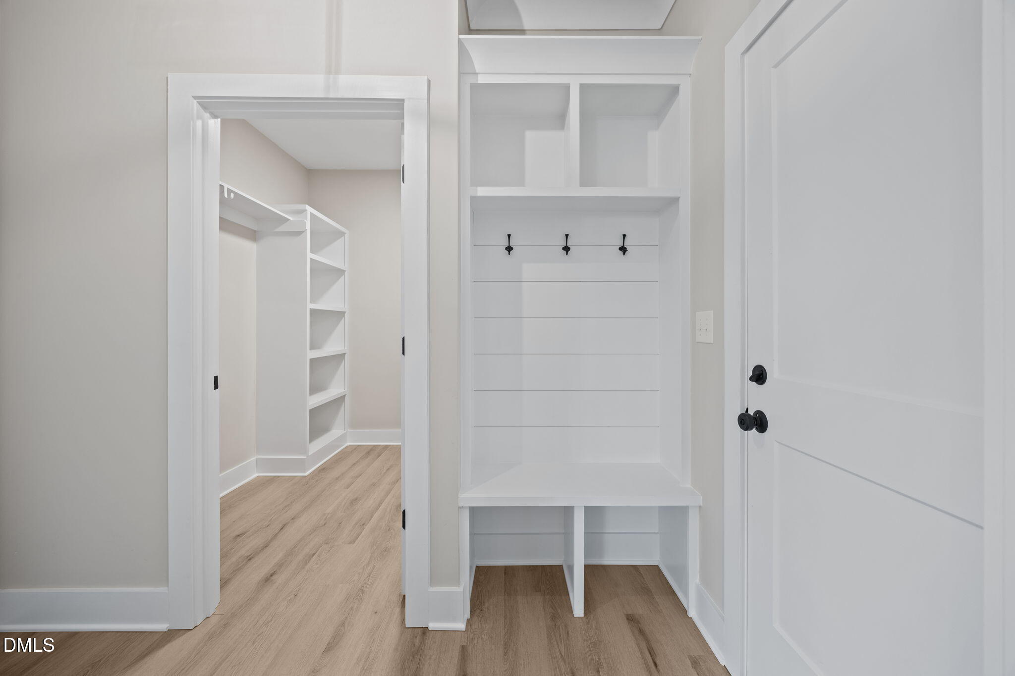 1221 Antioch Church Road Timberlake, NC 27583 - Photo 17 of 45 a view of a walk in closet with wooden floor
