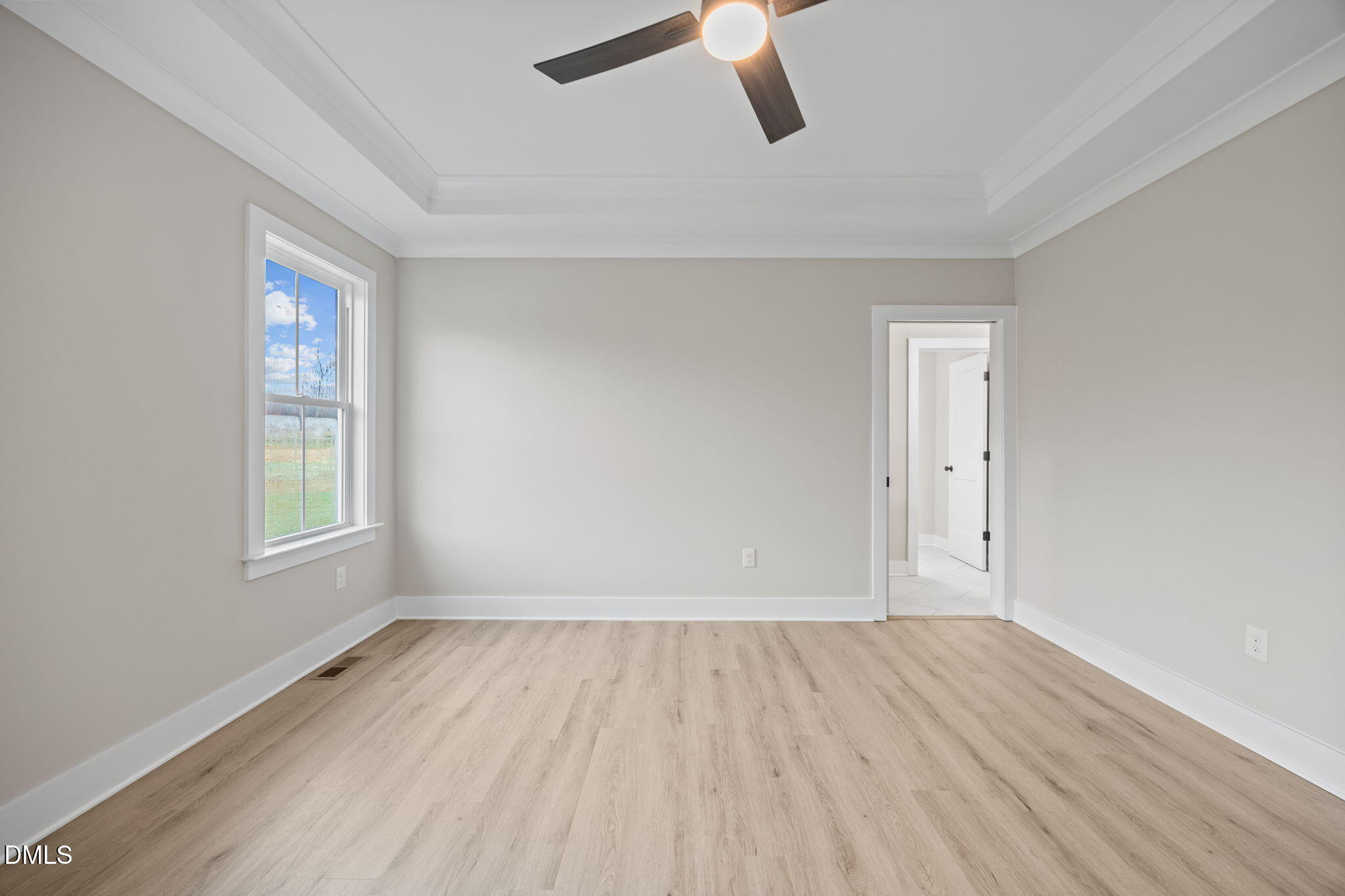 1221 Antioch Church Road Timberlake, NC 27583 - Photo 21 of 45 an empty room with wooden floor cabinet and windows