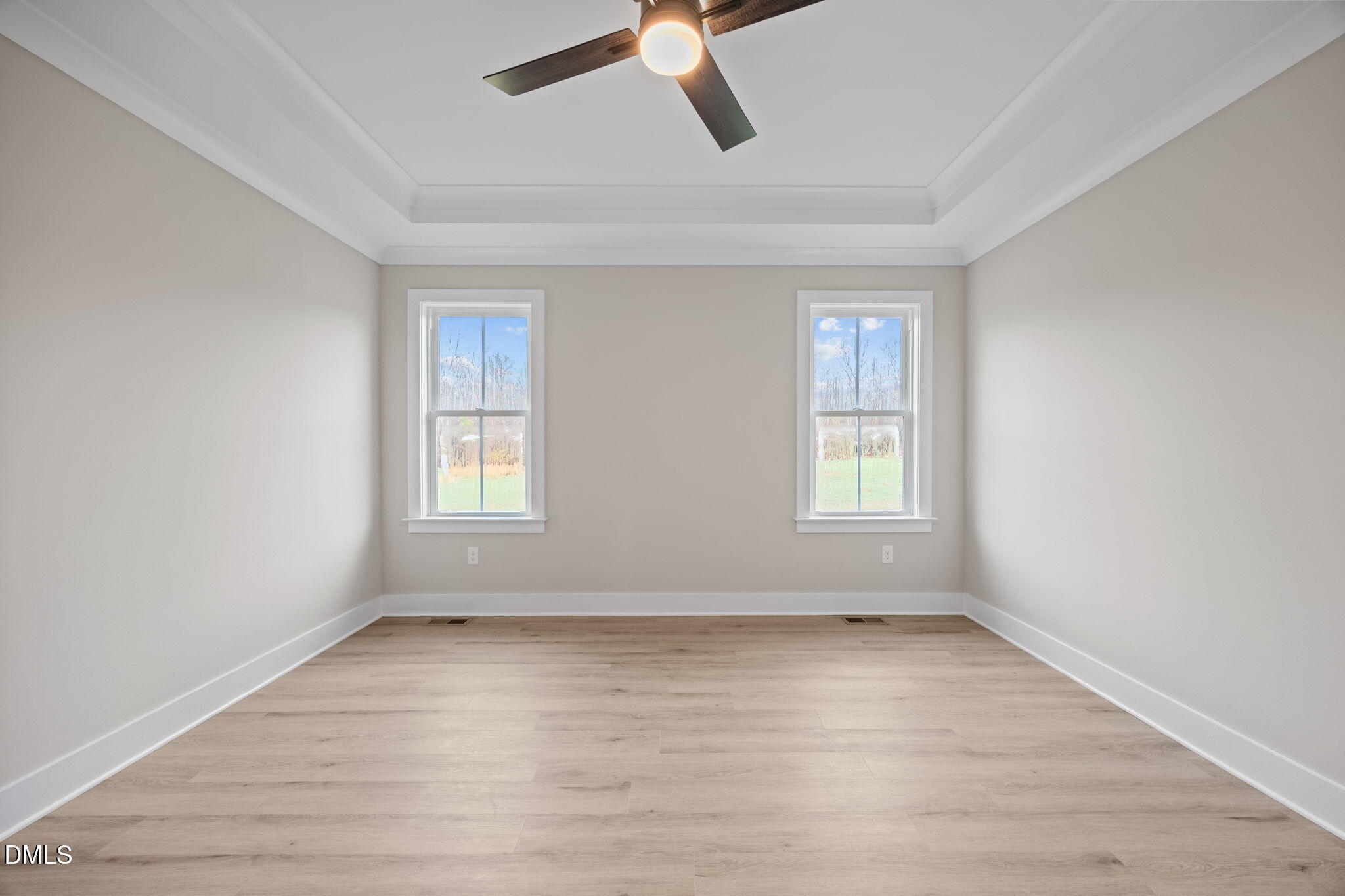 1221 Antioch Church Road Timberlake, NC 27583 - Photo 22 of 45 an empty room with wooden floor fan and windows