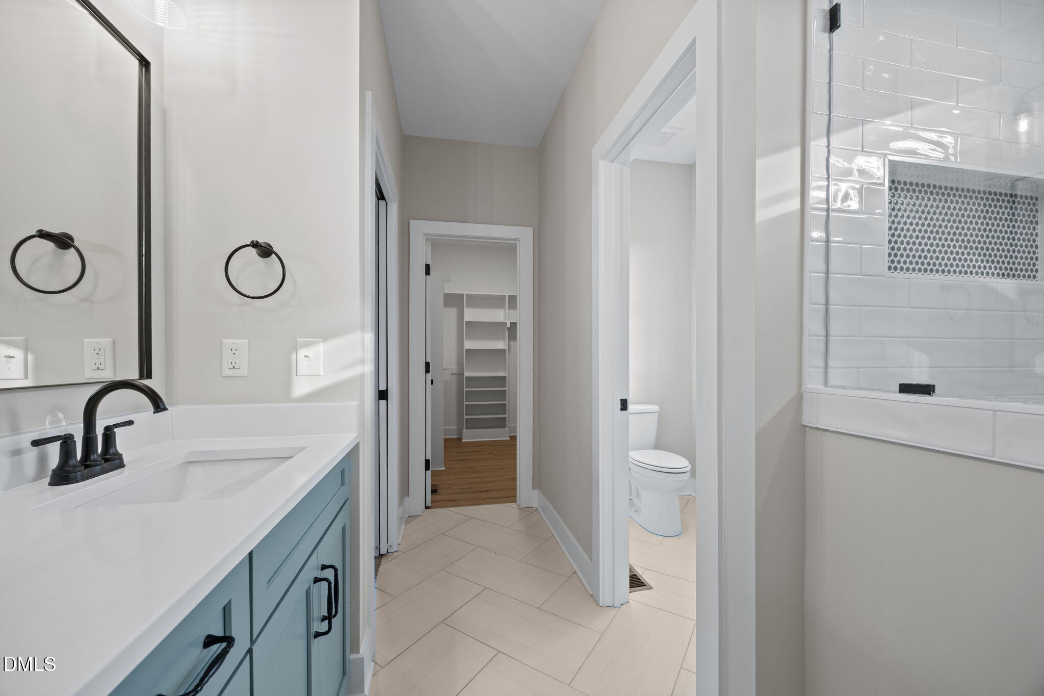 1221 Antioch Church Road Timberlake, NC 27583 - Photo 25 of 45 a bathroom with a sink a toilet and shower