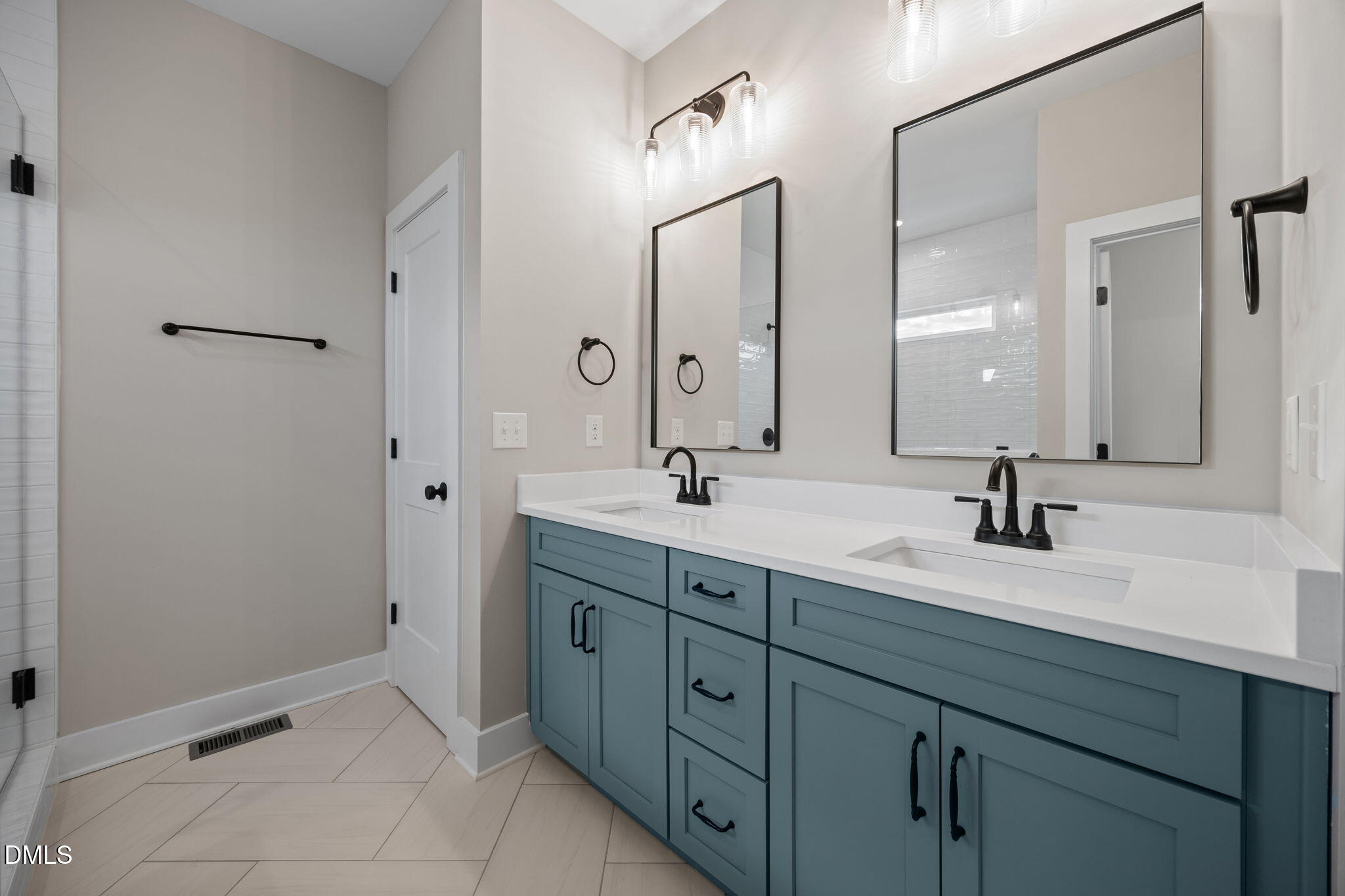 1221 Antioch Church Road Timberlake, NC 27583 - Photo 26 of 45 a bathroom with double sink and a mirror