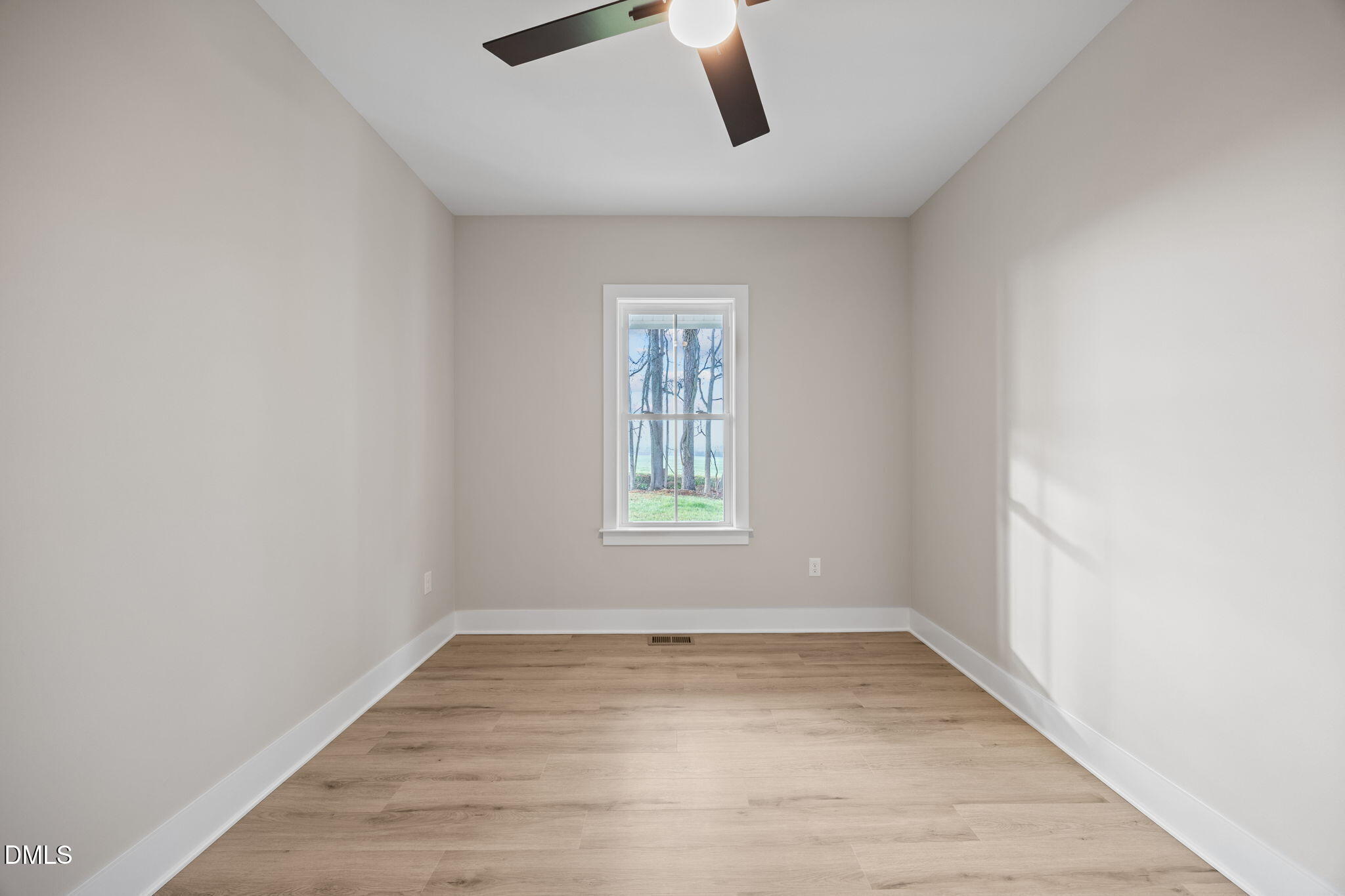 1221 Antioch Church Road Timberlake, NC 27583 - Photo 29 of 45 a view of empty room with wooden floor and window