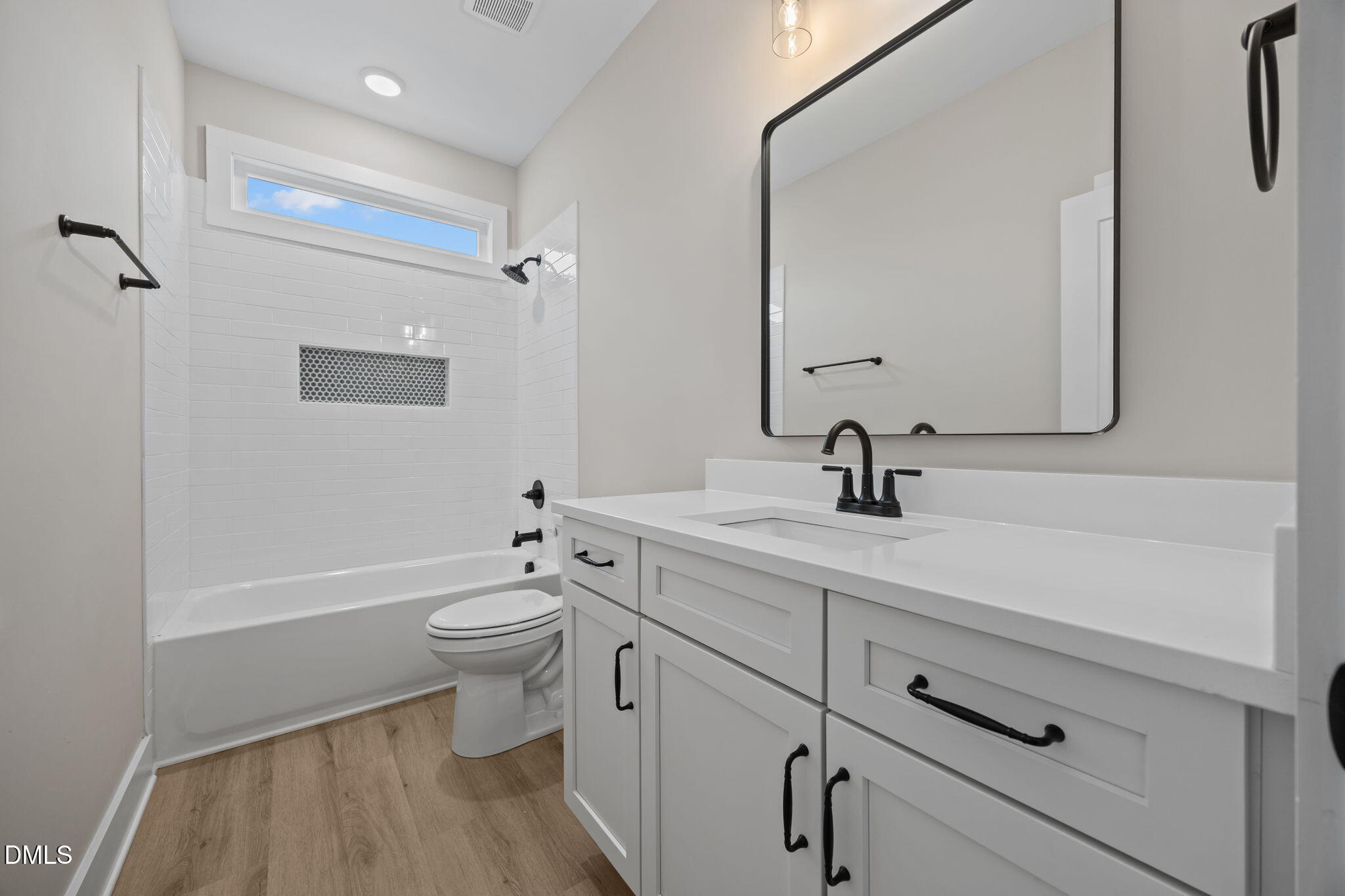1221 Antioch Church Road Timberlake, NC 27583 - Photo 30 of 45 a bathroom with a double vanity sink and mirror with toilet