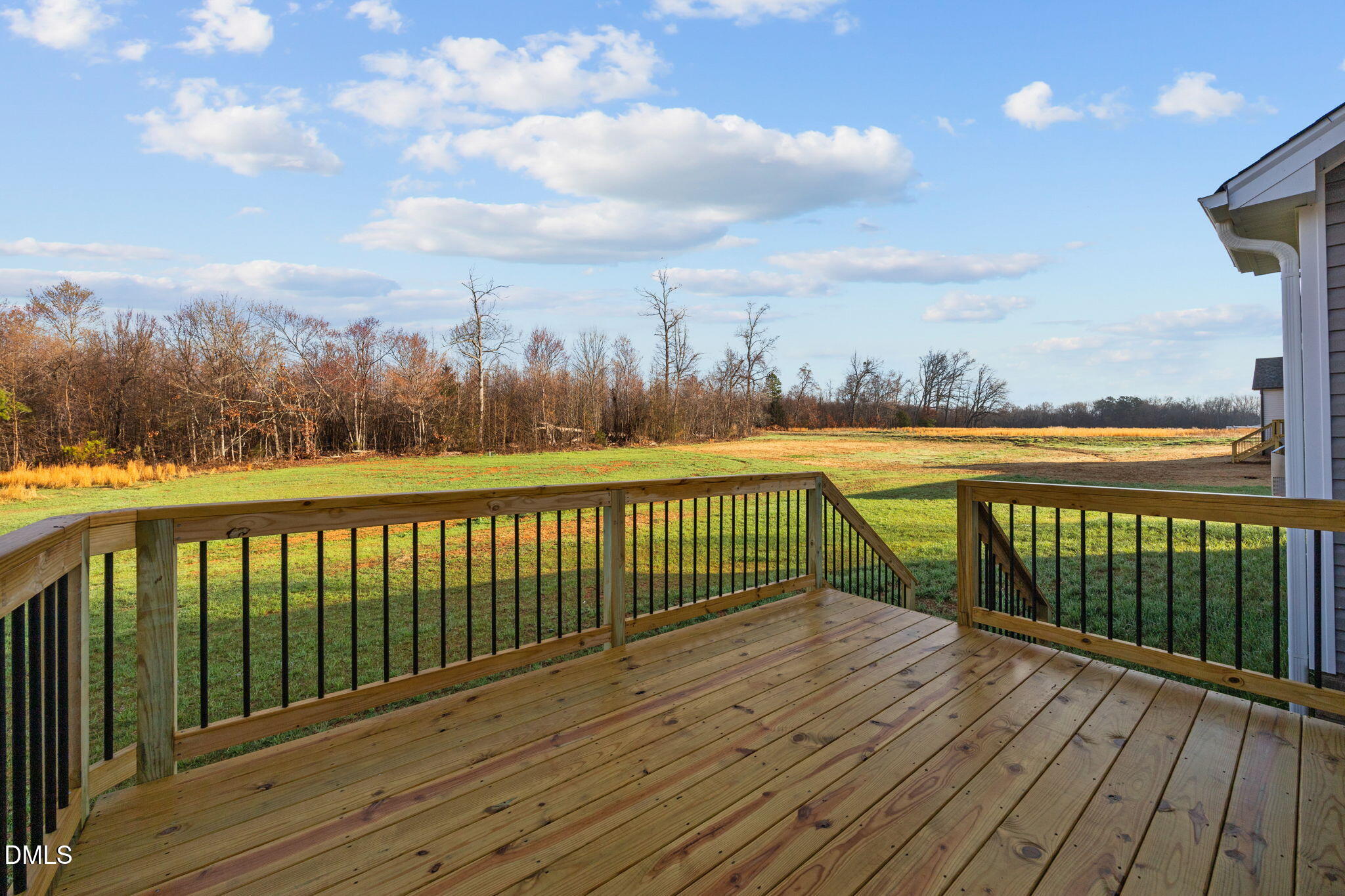 1221 Antioch Church Road Timberlake, NC 27583 - Photo 32 of 45 a view of a balcony with wooden floor & fence