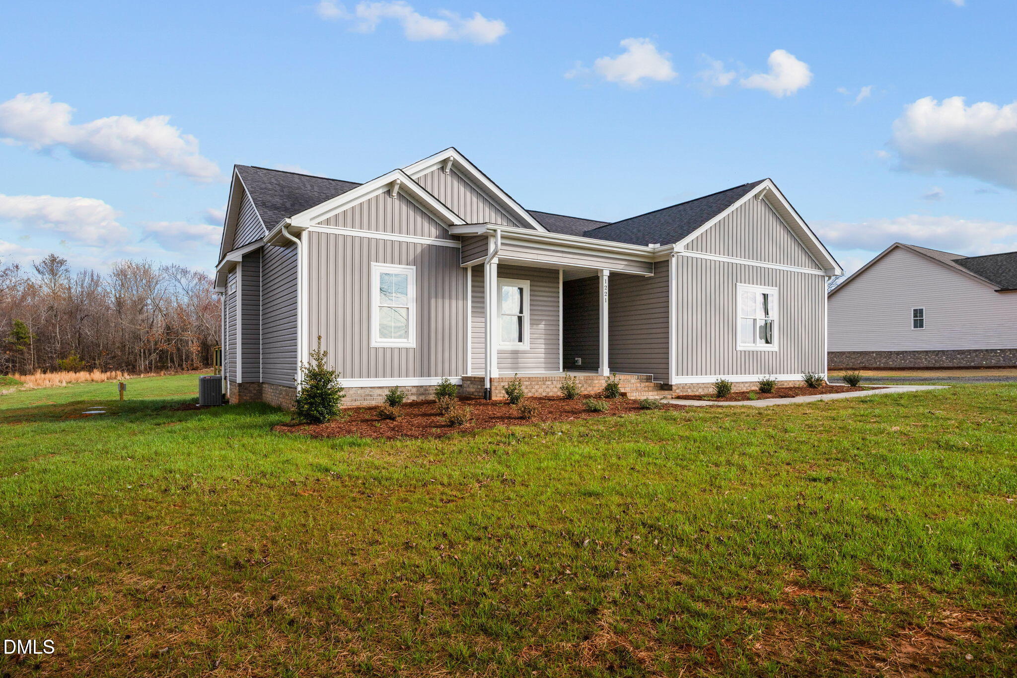 1221 Antioch Church Road Timberlake, NC 27583 - Photo 44 of 45 a front view of a house with garden